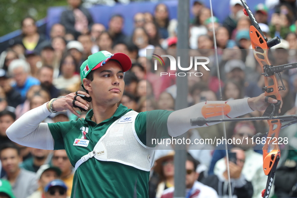 Matias Grande of Mexico competes against Mauro Nespoli of Italy (not in picture) during the Men's recurve quarterfinals match on the final d...