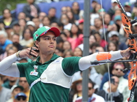 Matias Grande of Mexico competes against Mauro Nespoli of Italy (not in picture) during the Men's recurve quarterfinals match on the final d...