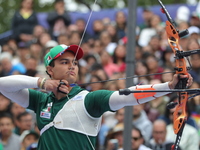 Matias Grande of Mexico competes against Mauro Nespoli of Italy (not in picture) during the Men's recurve quarterfinals match on the final d...