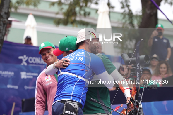 Matias Grande of Mexico and Mauro Nespoli of Italy compete during the Men's recurve quarterfinals match on the final day of the Tlaxcala 202...