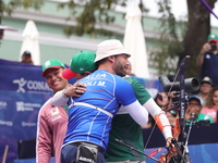 Matias Grande of Mexico and Mauro Nespoli of Italy compete during the Men's recurve quarterfinals match on the final day of the Tlaxcala 202...