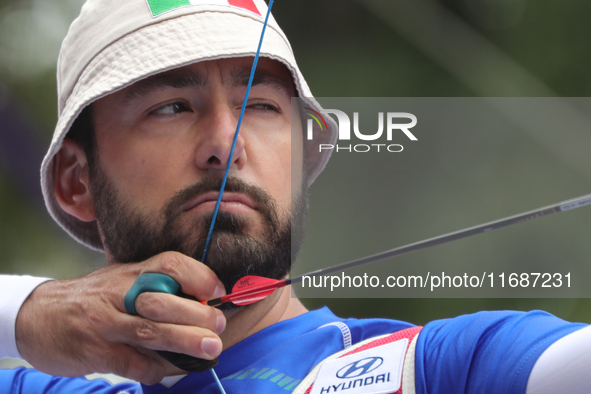 Mauro Nespoli of Italy competes against Matias Grande of Mexico (not in picture) during the Men's recurve quarterfinals match on the final d...