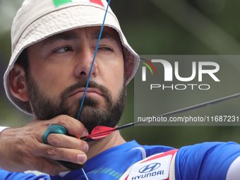 Mauro Nespoli of Italy competes against Matias Grande of Mexico (not in picture) during the Men's recurve quarterfinals match on the final d...