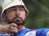 Mauro Nespoli of Italy competes against Matias Grande of Mexico (not in picture) during the Men's recurve quarterfinals match on the final d...