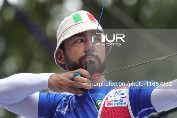 Mauro Nespoli of Italy competes against Matias Grande of Mexico (not in picture) during the Men's recurve quarterfinals match on the final d...