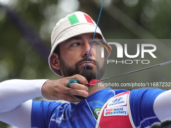 Mauro Nespoli of Italy competes against Matias Grande of Mexico (not in picture) during the Men's recurve quarterfinals match on the final d...