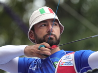 Mauro Nespoli of Italy competes against Matias Grande of Mexico (not in picture) during the Men's recurve quarterfinals match on the final d...