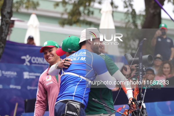 Matias Grande of Mexico and Mauro Nespoli of Italy compete during the Men's recurve quarterfinals match on the final day of the Tlaxcala 202...