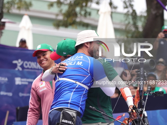 Matias Grande of Mexico and Mauro Nespoli of Italy compete during the Men's recurve quarterfinals match on the final day of the Tlaxcala 202...