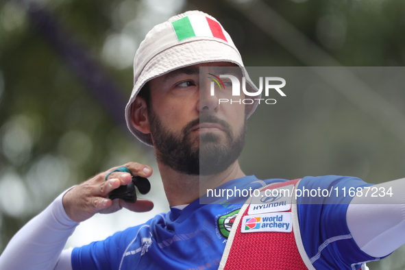 Mauro Nespoli of Italy competes against Matias Grande of Mexico (not in picture) during the Men's recurve quarterfinals match on the final d...