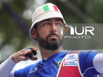 Mauro Nespoli of Italy competes against Matias Grande of Mexico (not in picture) during the Men's recurve quarterfinals match on the final d...