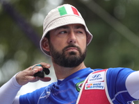 Mauro Nespoli of Italy competes against Matias Grande of Mexico (not in picture) during the Men's recurve quarterfinals match on the final d...