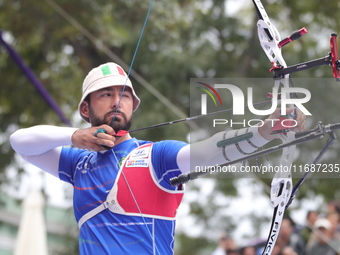 Mauro Nespoli of Italy competes against Matias Grande of Mexico (not in picture) during the Men's recurve quarterfinals match on the final d...