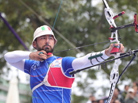 Mauro Nespoli of Italy competes against Matias Grande of Mexico (not in picture) during the Men's recurve quarterfinals match on the final d...