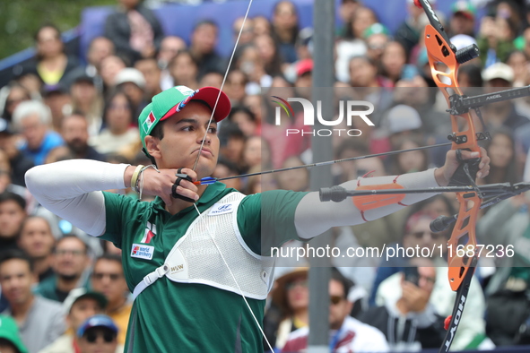 Matias Grande of Mexico competes against Mauro Nespoli of Italy (not in picture) during the Men's recurve quarterfinals match on the final d...