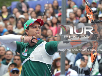 Matias Grande of Mexico competes against Mauro Nespoli of Italy (not in picture) during the Men's recurve quarterfinals match on the final d...