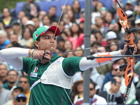 Matias Grande of Mexico competes against Mauro Nespoli of Italy (not in picture) during the Men's recurve quarterfinals match on the final d...