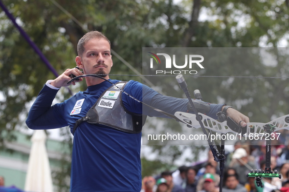 Marcus D'Almeida of Brazil competes against Andres Temino of Spain (not in picture) during the Men's recurve quarterfinals match on the fina...