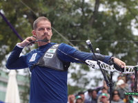 Marcus D'Almeida of Brazil competes against Andres Temino of Spain (not in picture) during the Men's recurve quarterfinals match on the fina...