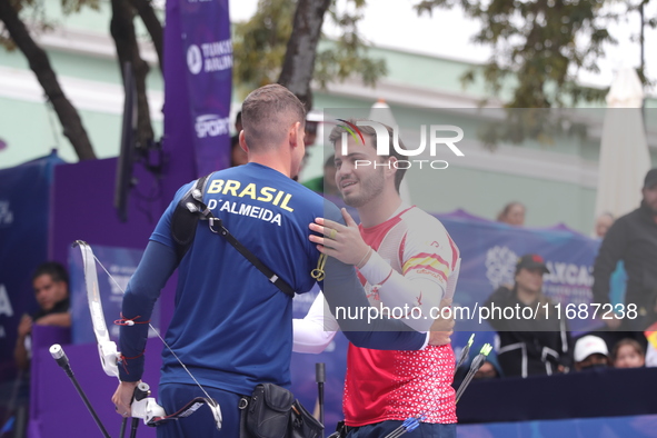 Marcus D'Almeida of Brazil and Andres Temino of Spain compete during the Men's recurve quarterfinals match on the final day of the Tlaxcala...