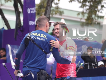 Marcus D'Almeida of Brazil and Andres Temino of Spain compete during the Men's recurve quarterfinals match on the final day of the Tlaxcala...