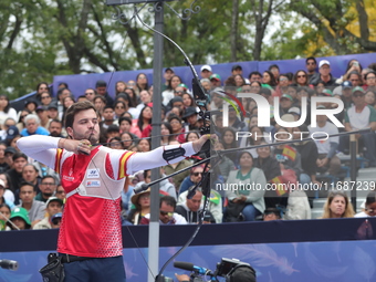 Andres Temino of Spain competes against Marcus D'Almeida of Brazil (not in picture) during the Men's recurve quarterfinals match on the fina...