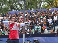 Andres Temino of Spain competes against Marcus D'Almeida of Brazil (not in picture) during the Men's recurve quarterfinals match on the fina...