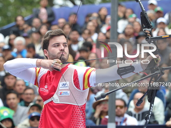 Andres Temino of Spain competes against Marcus D'Almeida of Brazil (not in picture) during the Men's recurve quarterfinals match on the fina...