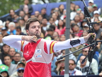 Andres Temino of Spain competes against Marcus D'Almeida of Brazil (not in picture) during the Men's recurve quarterfinals match on the fina...