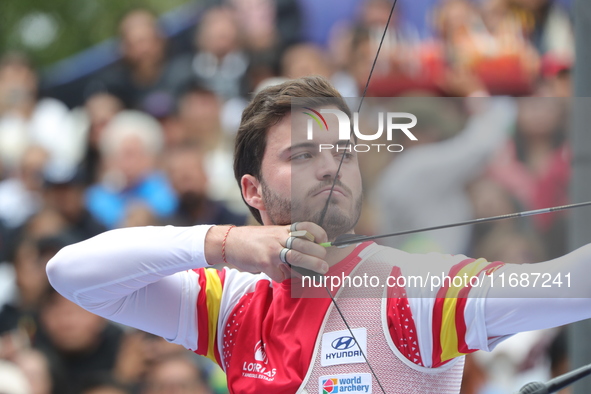 Andres Temino of Spain competes against Marcus D'Almeida of Brazil (not in picture) during the Men's recurve quarterfinals match on the fina...