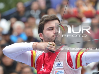 Andres Temino of Spain competes against Marcus D'Almeida of Brazil (not in picture) during the Men's recurve quarterfinals match on the fina...