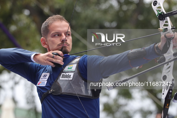 Marcus D'Almeida of Brazil competes against Andres Temino of Spain (not in picture) during the Men's recurve quarterfinals match on the fina...