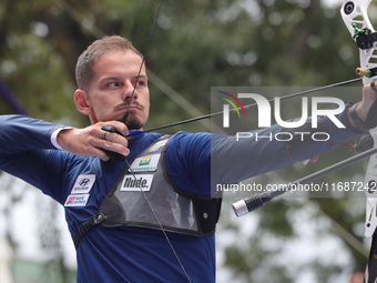 Marcus D'Almeida of Brazil competes against Andres Temino of Spain (not in picture) during the Men's recurve quarterfinals match on the fina...