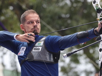 Marcus D'Almeida of Brazil competes against Andres Temino of Spain (not in picture) during the Men's recurve quarterfinals match on the fina...