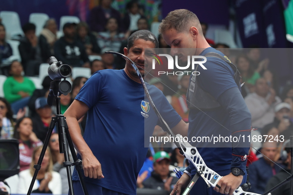 Marcus D'Almeida of Brazil competes against Andres Temino of Spain (not in picture) during the Men's recurve quarterfinals match on the fina...