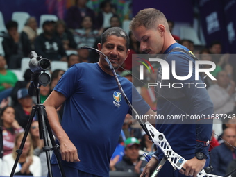 Marcus D'Almeida of Brazil competes against Andres Temino of Spain (not in picture) during the Men's recurve quarterfinals match on the fina...