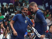 Marcus D'Almeida of Brazil competes against Andres Temino of Spain (not in picture) during the Men's recurve quarterfinals match on the fina...