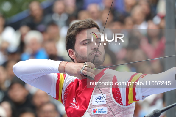 Andres Temino of Spain competes against Marcus D'Almeida of Brazil (not in picture) during the Men's recurve quarterfinals match on the fina...