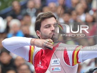 Andres Temino of Spain competes against Marcus D'Almeida of Brazil (not in picture) during the Men's recurve quarterfinals match on the fina...