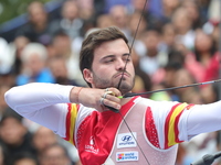 Andres Temino of Spain competes against Marcus D'Almeida of Brazil (not in picture) during the Men's recurve quarterfinals match on the fina...