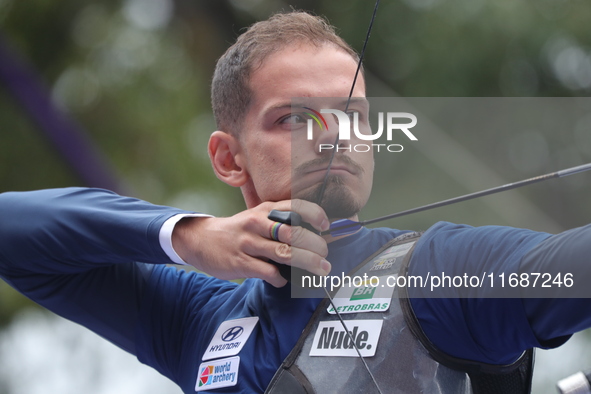 Marcus D'Almeida of Brazil competes against Andres Temino of Spain (not in picture) during the Men's recurve quarterfinals match on the fina...