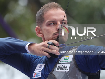 Marcus D'Almeida of Brazil competes against Andres Temino of Spain (not in picture) during the Men's recurve quarterfinals match on the fina...