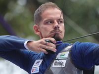 Marcus D'Almeida of Brazil competes against Andres Temino of Spain (not in picture) during the Men's recurve quarterfinals match on the fina...