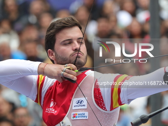 Andres Temino of Spain competes against Marcus D'Almeida of Brazil (not in picture) during the Men's recurve quarterfinals match on the fina...