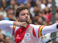 Andres Temino of Spain competes against Marcus D'Almeida of Brazil (not in picture) during the Men's recurve quarterfinals match on the fina...