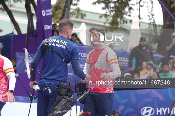 Marcus D'Almeida of Brazil and Andres Temino of Spain compete during the Men's recurve quarterfinals match on the final day of the Tlaxcala...