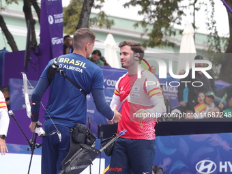 Marcus D'Almeida of Brazil and Andres Temino of Spain compete during the Men's recurve quarterfinals match on the final day of the Tlaxcala...