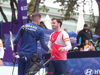 Marcus D'Almeida of Brazil and Andres Temino of Spain compete during the Men's recurve quarterfinals match on the final day of the Tlaxcala...