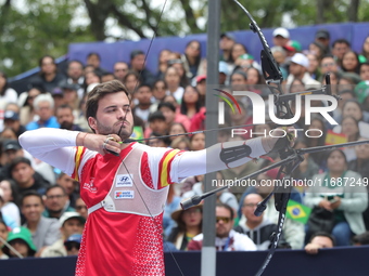 Andres Temino of Spain competes against Marcus D'Almeida of Brazil (not in picture) during the Men's recurve quarterfinals match on the fina...