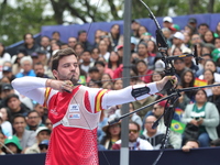 Andres Temino of Spain competes against Marcus D'Almeida of Brazil (not in picture) during the Men's recurve quarterfinals match on the fina...